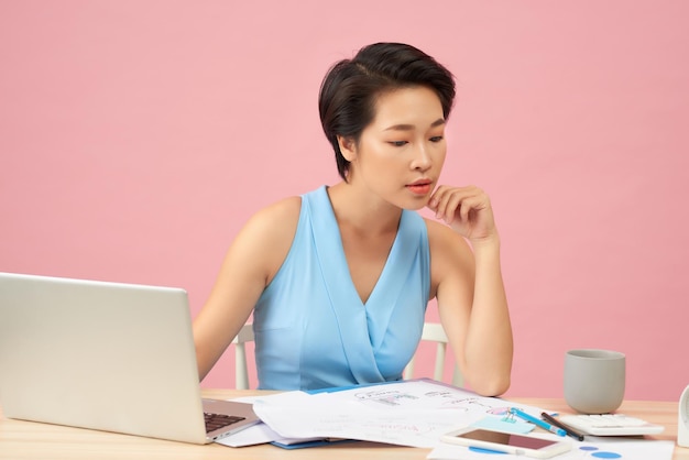 Beautiful young Asia woman working in office