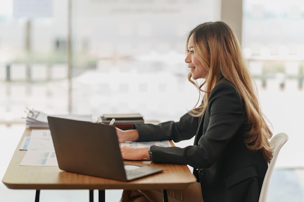 Beautiful young asian business woman at office