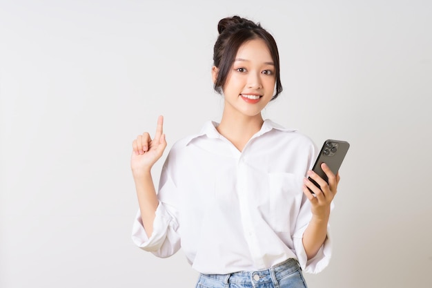 Beautiful young asian businesswoman portrait on white background