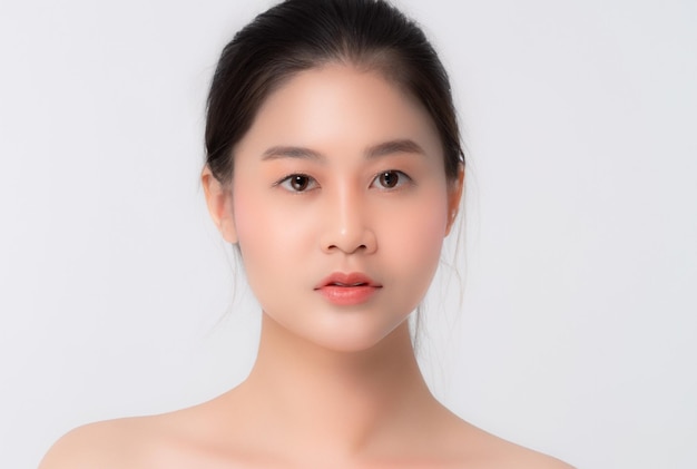 A Beautiful young asian girl with clean fresh skin on white background