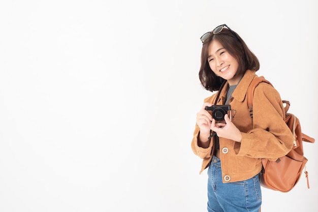 Beautiful young asian tourist woman happy
