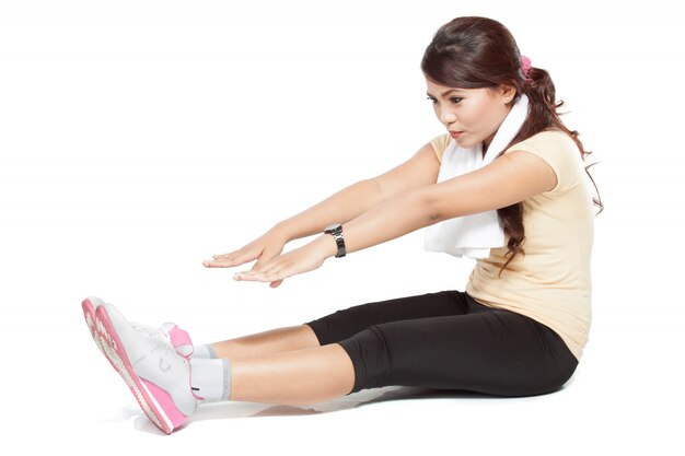 Beautiful young asian woman doing stretching, indoor