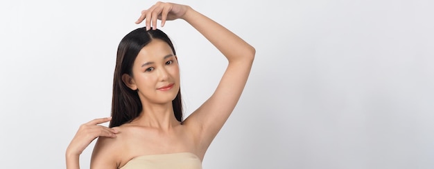 Beautiful young asian woman with clean fresh skin on white background