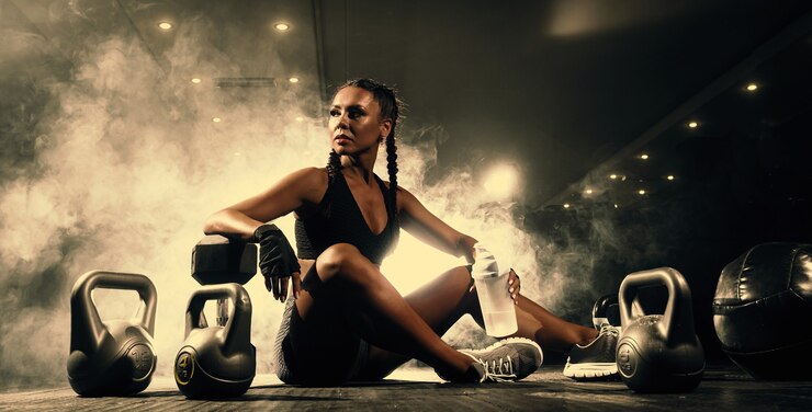 Photo beautiful young black sportswoman in the gym