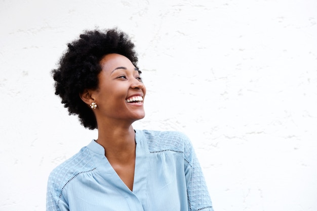 Beautiful young black woman looking away and smiling