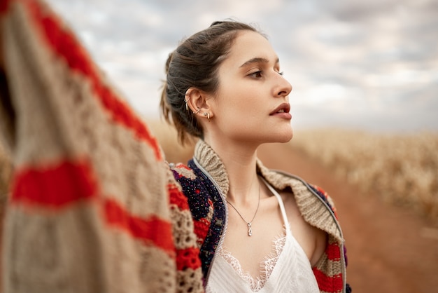 Beautiful young blond Latin woman outdoors portrait. Fashion concept.