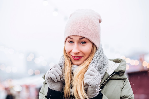 Beautiful young blond woman on the Christmas market