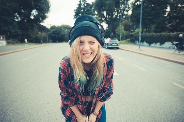 beautiful young blonde hair woman hipster listening music