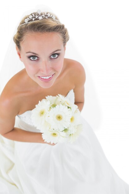 Beautiful young bride holding a bouquet