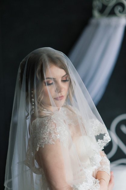 Beautiful young bride in white lingerie