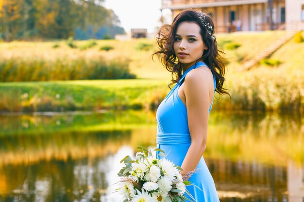 Beautiful young bridesmaid with curly hair