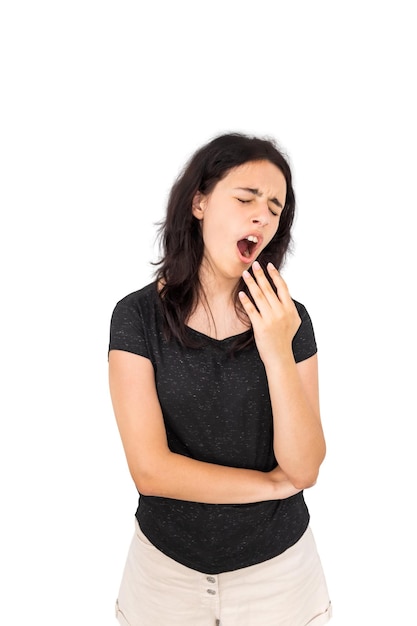 Beautiful young brunette girl yawns Isolated on white background