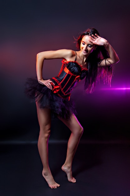 Beautiful young burlesque showgirl, studio shot