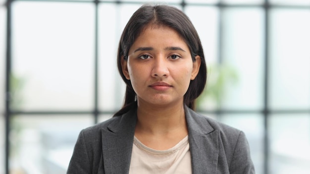 Beautiful young business woman at the office working place