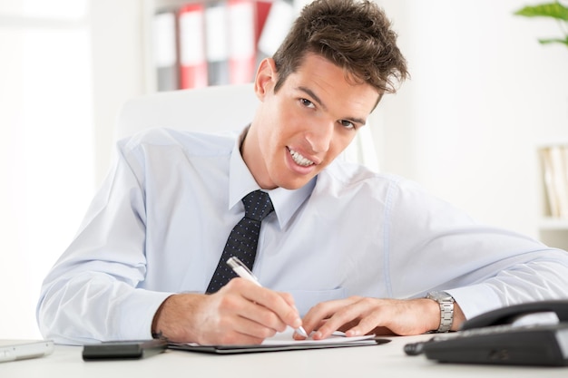 Beautiful young Businessman sitting in the office.