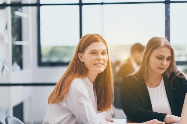 Beautiful young businesswoman smiling face and working in office