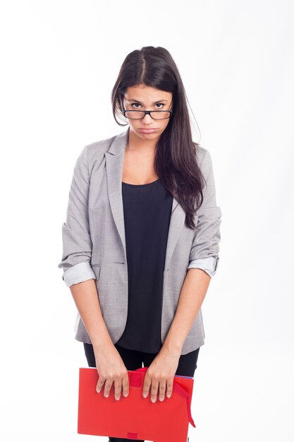 Beautiful young businesswoman tired with a red folder