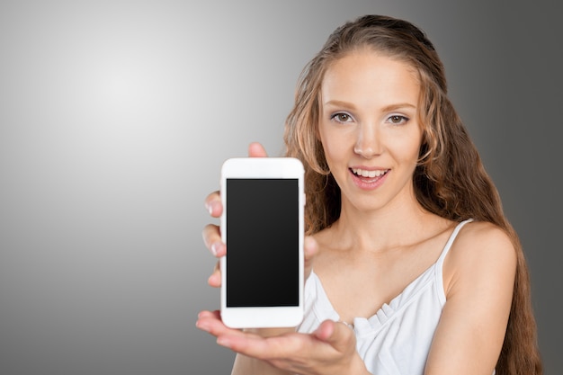 Beautiful young caucasian business woman with smart phone 