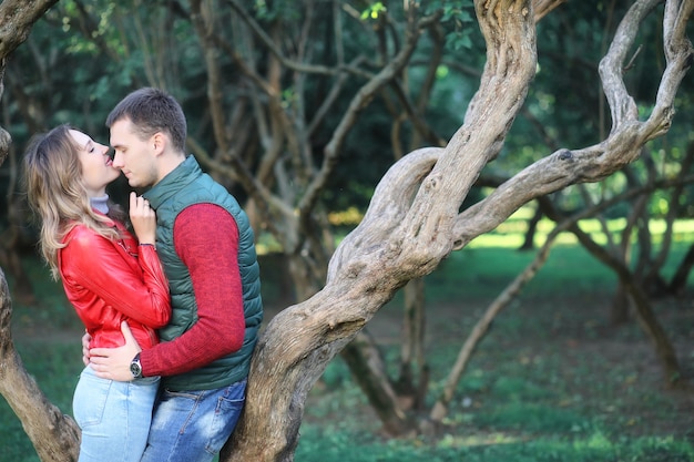 Beautiful young couple on date in the park during the day