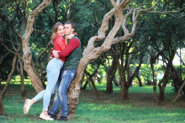 Beautiful young couple on date in the park during the day