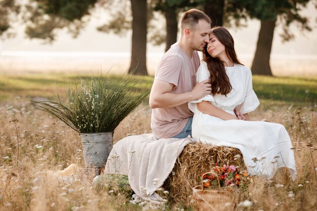 Beautiful young couple hugging in the summer park