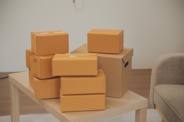 Beautiful young couple in love having fun unpacking things from cardboard boxes while moving in together in their new apartment