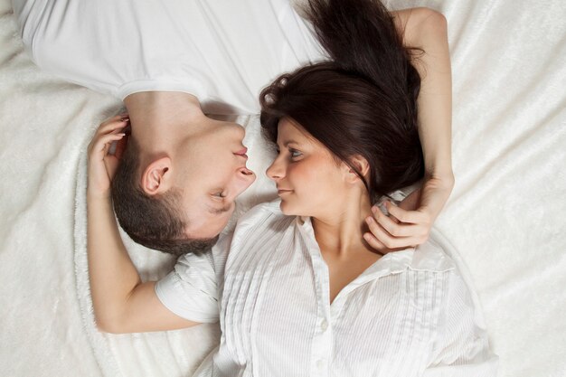 Beautiful young couple lying down