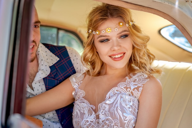 Beautiful young couple sitting in car romantic relationship