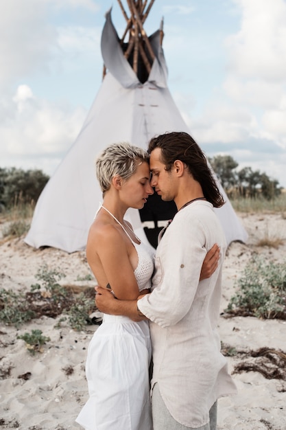  Beautiful young couple standing face to face and kissing