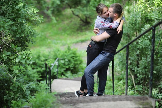 Beautiful young couple on a walk in the spring park