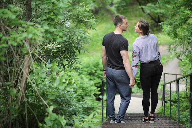 Beautiful young couple on a walk in the spring park