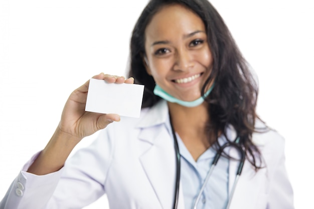 Beautiful young doctor holding business card