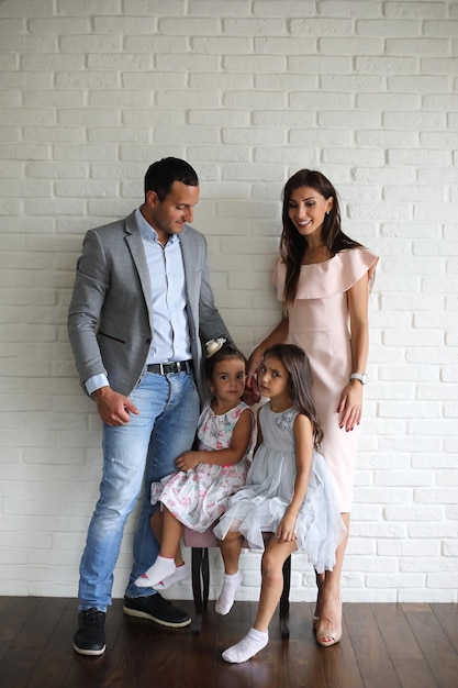 Beautiful young family with daughters