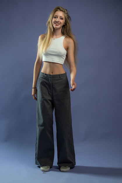 Beautiful young fashion woman posing in studio