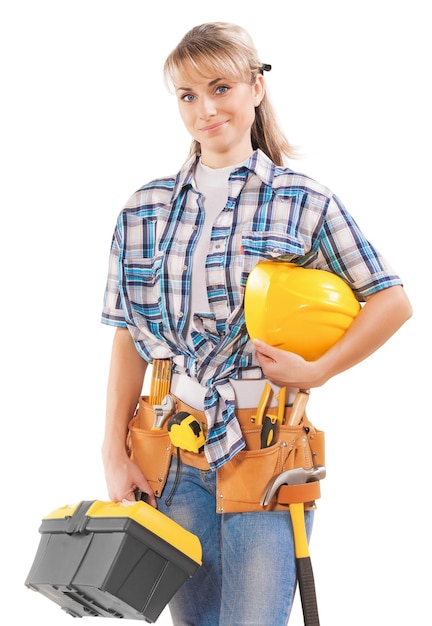 Beautiful young female construction contractor with tools isolated on white background