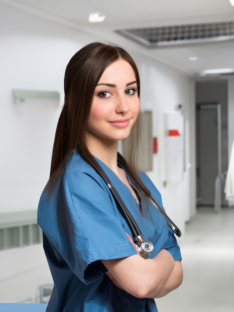 beautiful young female doctor looking at camera in the hospital