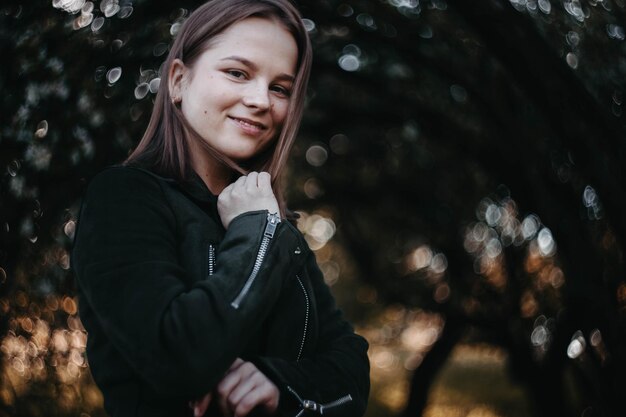 beautiful young girl in a blooming park in spring