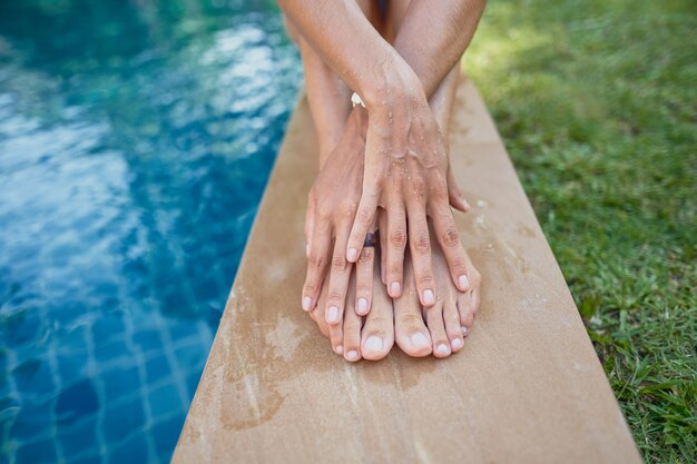 beautiful young girl by the pool