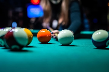 Premium Photo  Beautiful young girl came on a weekend to play billiards  for curiosity concept of a girl playing billiards