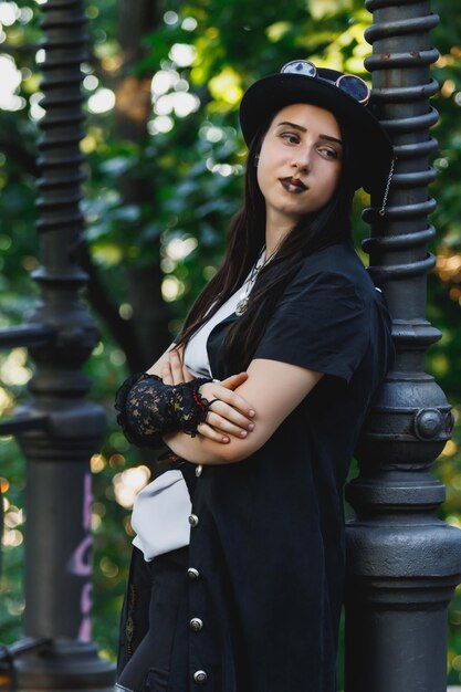 Beautiful young girl dressed in style steampunk