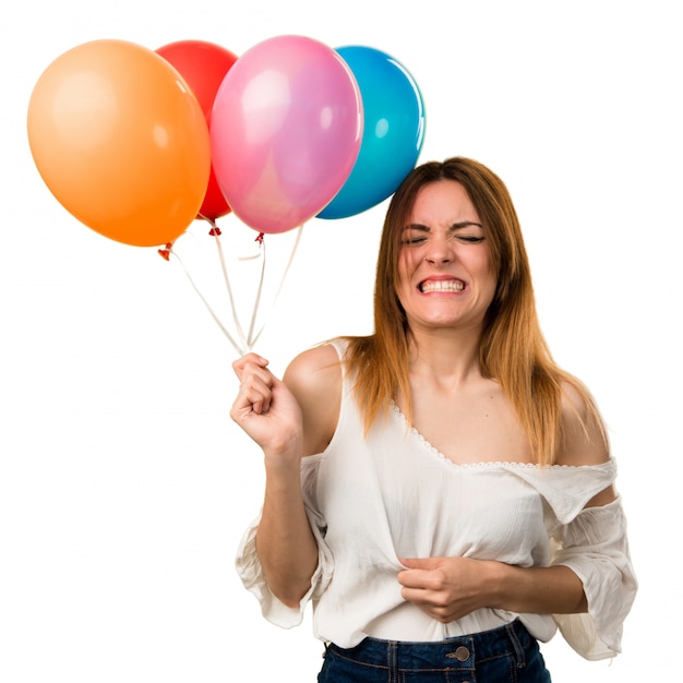 Beautiful young girl holding a balloon and