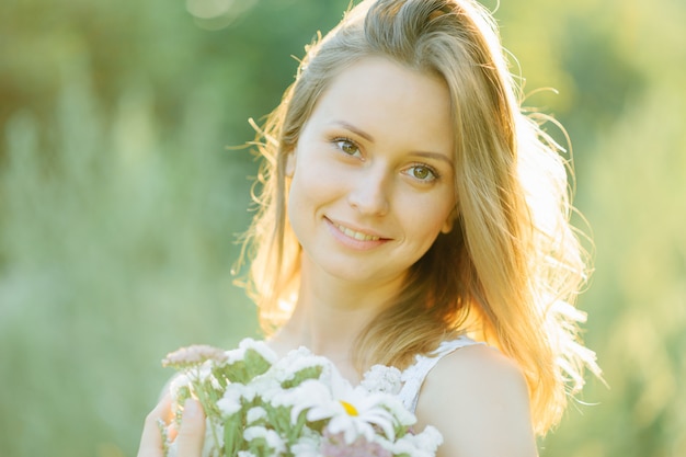 Beautiful young girl posing in front of the camera Spring mood