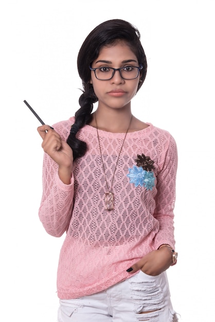 Beautiful young girl posing on white space.