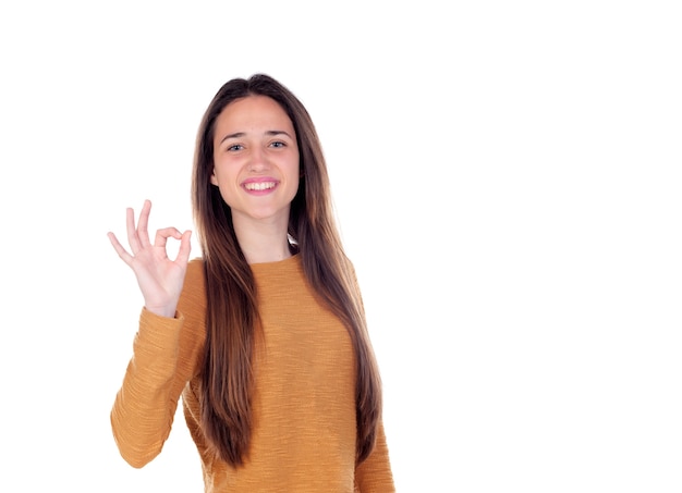 Beautiful young girl showing ok sign  