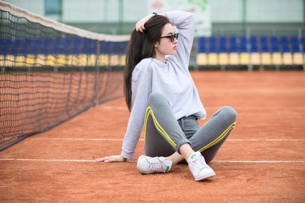 Beautiful young girl at the stadium for tennisSports woman