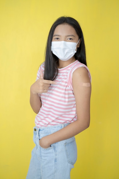 Beautiful young girl vaccination ,wear mask.