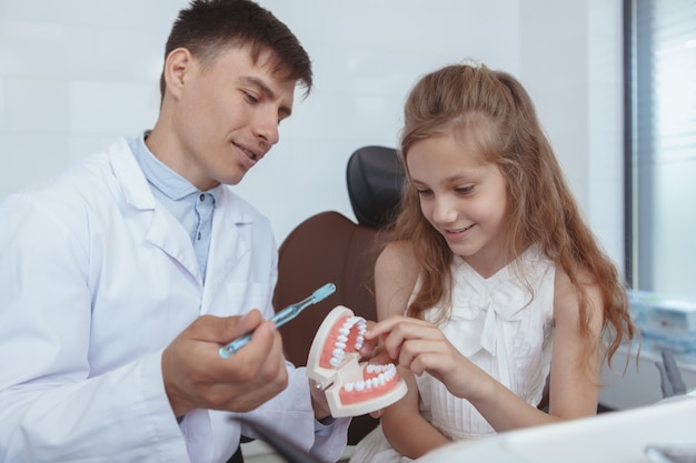 Beautiful young girl visiting dentist