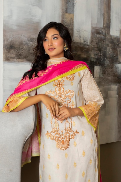 Beautiful Young Girl Wearing White Traditional Dress for Fashion Shoot in a room