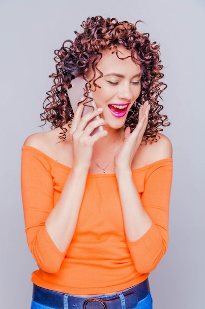 Beautiful young girl with curly hair