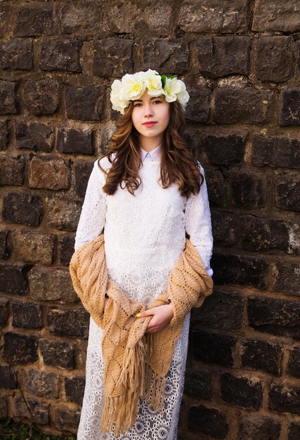 Beautiful young girl with a floral hairband